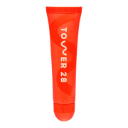 The Tower 28 Beauty LipSoftie™ Lip Treatment in the shade SOS Vanilla. [SOS Vanilla]
