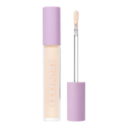 Tower 28 Beauty Swipe Serum Concealer in the shade 1.0 BH, shown with the tube standing upright next to the open applicator wand to reveal the product. [1.0 BH]